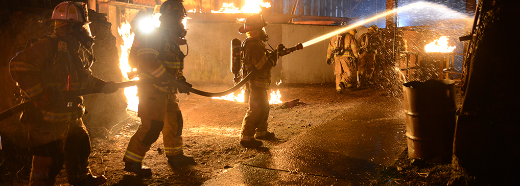 firefighters with hose